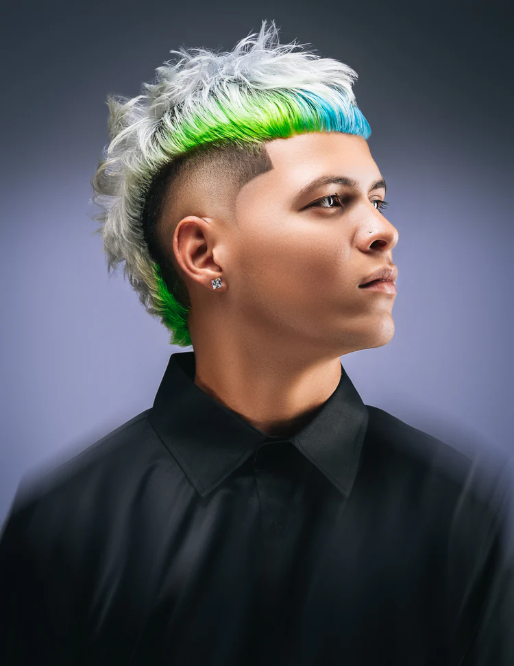 a man with green and blue hair